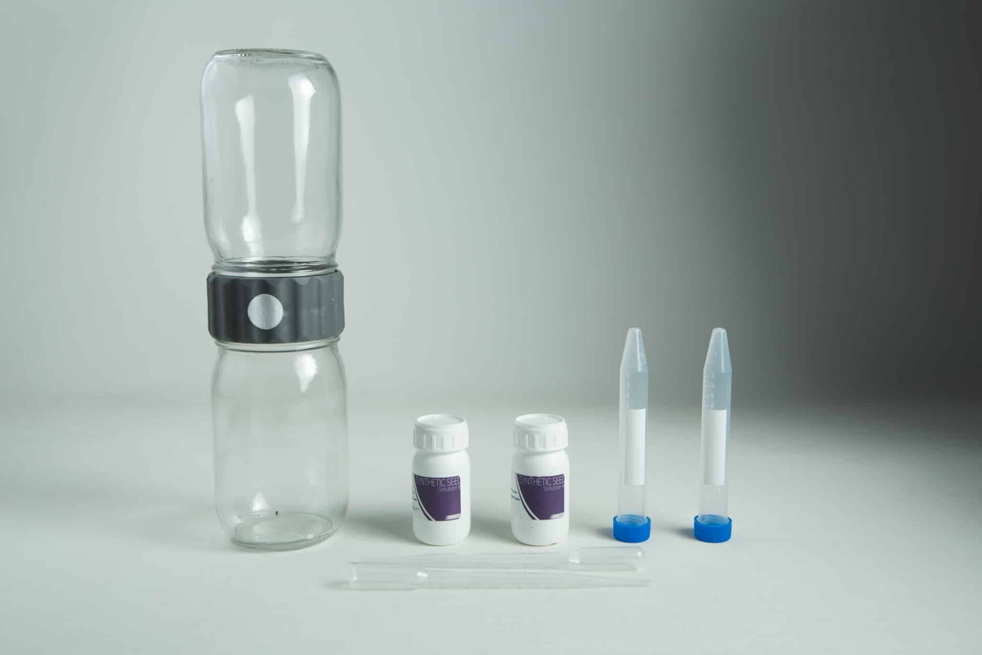 Plant Cell Synthetic Seed Starter Kit 1 A water testing kit with bottles, vials, dropper, and containers on a grey background—ideal for use with your Plantcell Synthetic Seed Starter Kit to ensure optimal hydration and healthy plant growth.