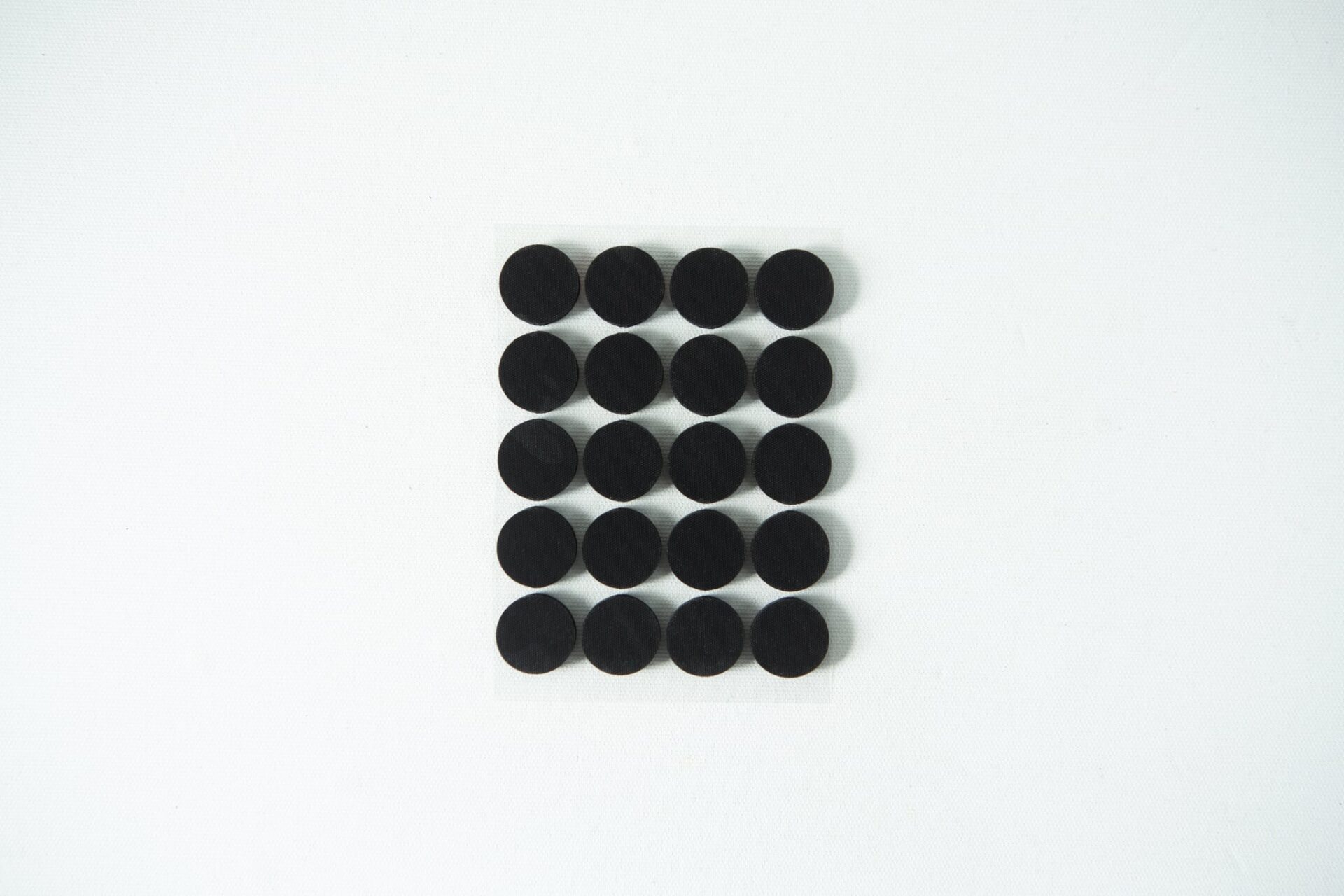 Self-healing injection port & Air Vent Filter-3M 13 Twenty black circular dots arranged in a 4 by 5 grid on a white background.
