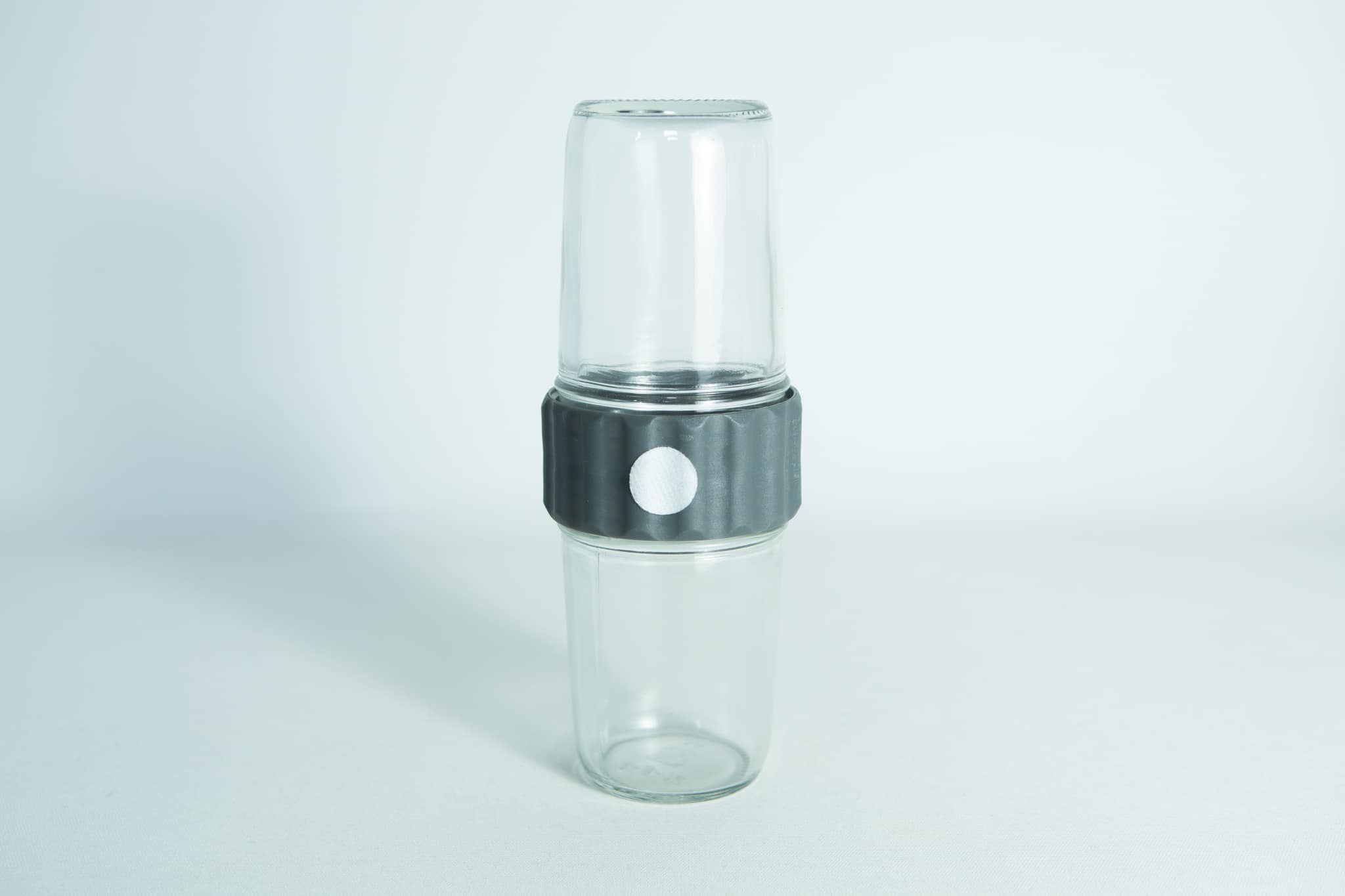 Plant Cell Biocoupler™ Glass Set 16oz, 12oz, 8oz 6 Two clear Plant Cell Biocoupler™ Glass Set cups (16oz, 12oz) are stacked with a black and white band around the middle, shown against a white background.