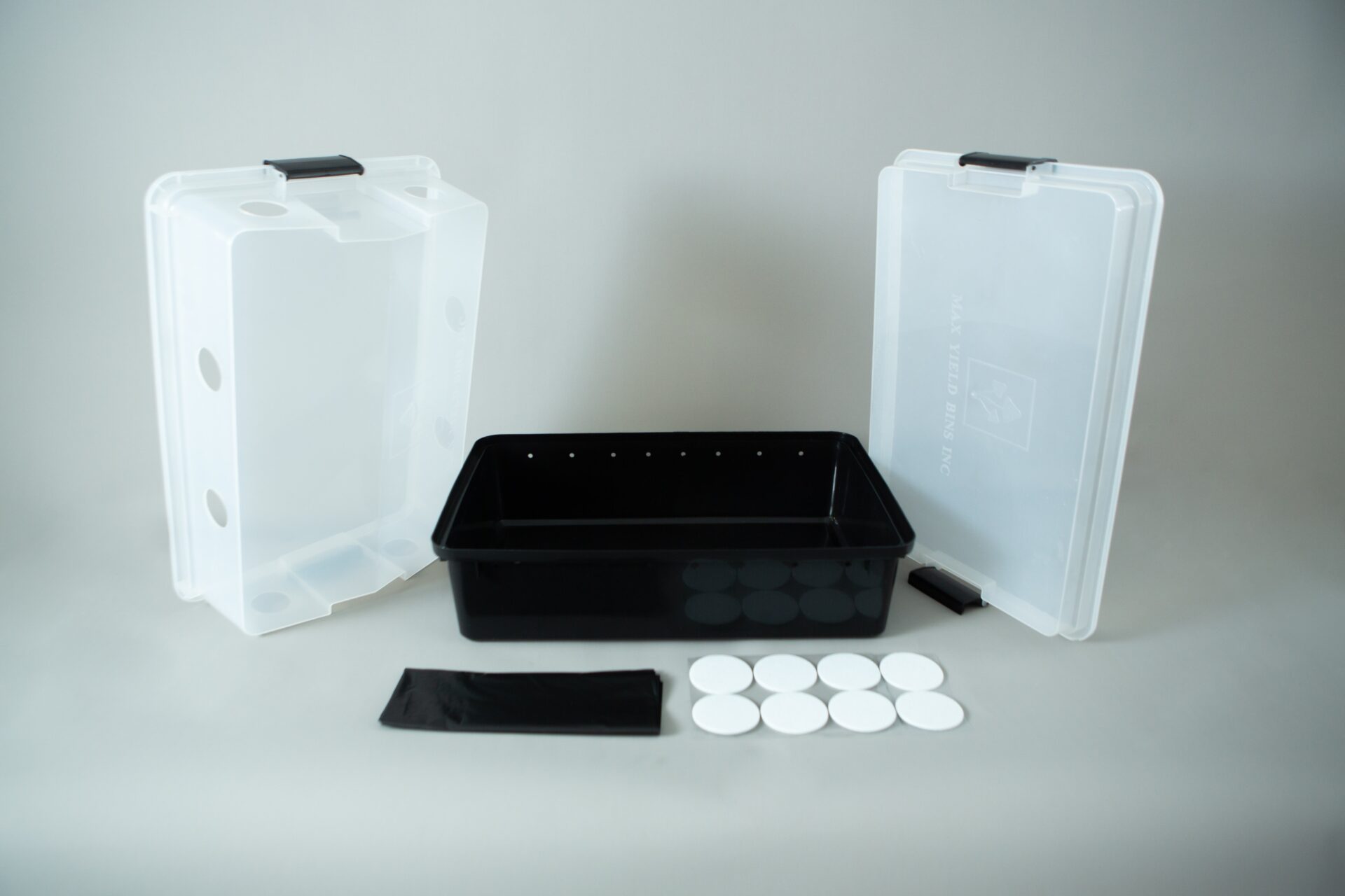 Monotub kit for Growing mushrooms- Max Yield Bins 1 Plastic mushroom growing kit with a black tray, Colonisation Lid, two clear lids, filter discs, and a black filter patch—ideal for growing mushrooms at home.