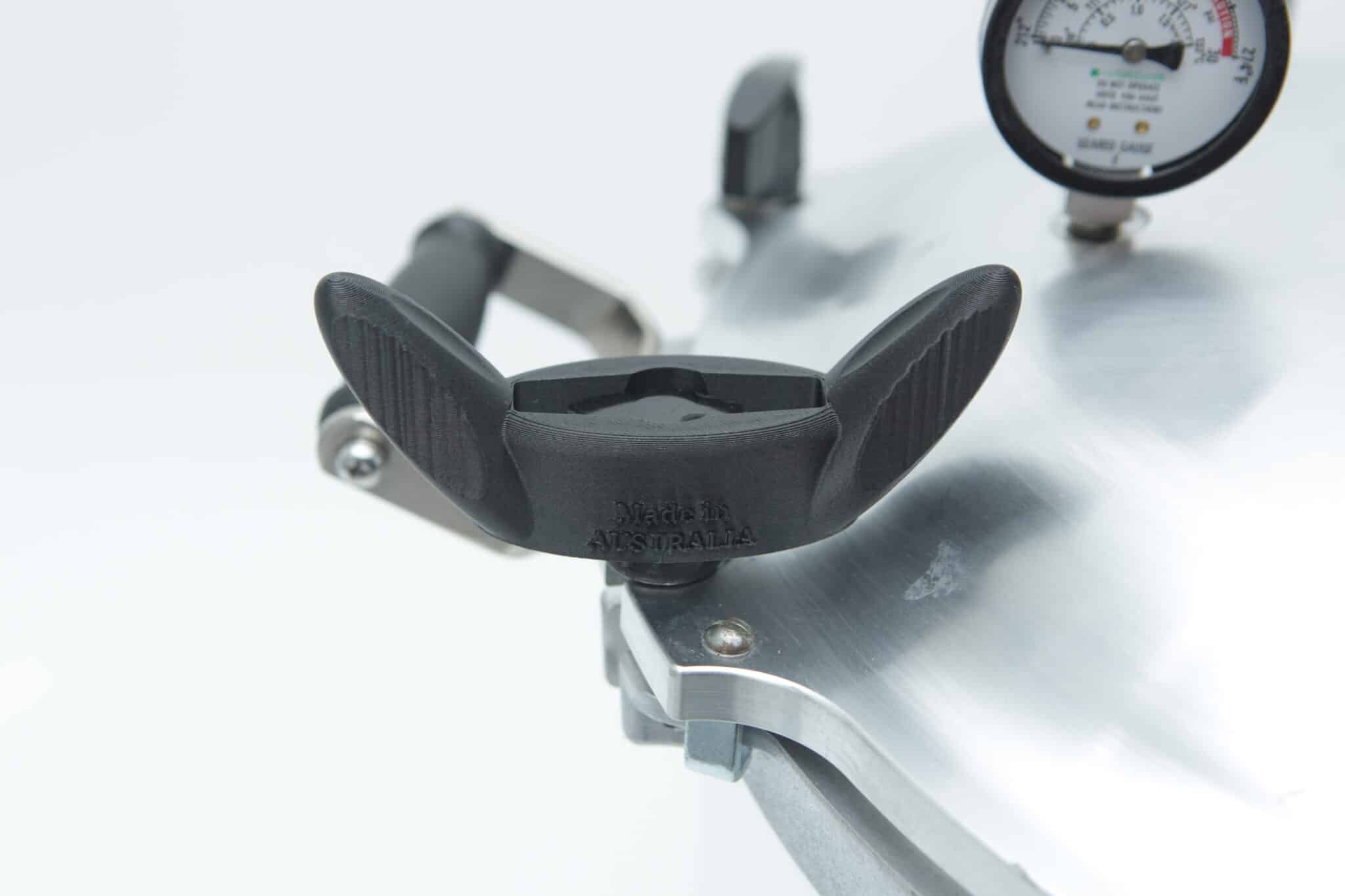 Wingnut Wrench for All American Steriliser | Rootlab Original | 3D Printed 2 Close-up of an All American Tool pressure cooker lid featuring a black handle and pressure gauge, set against a white background.