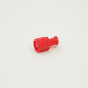 Small red sterile syringe cap with a ridged grip, placed on a plain white background.