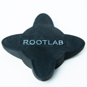 A black, four-pointed object with ROOTLAB written on it, placed on a white background.
