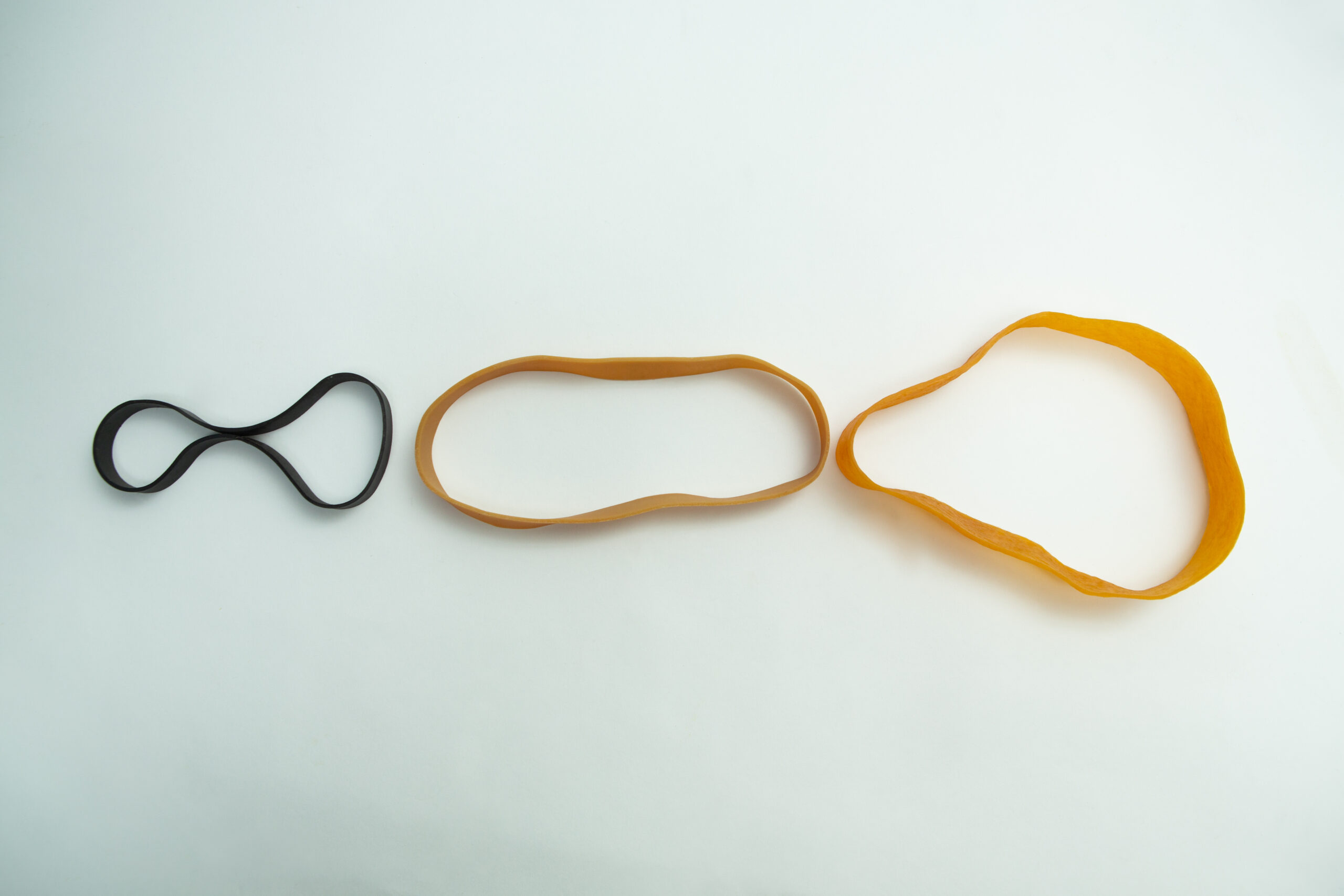 Fruiting Rubber Band for Mushroom growing 10pcs | Reusable 2 Ten reusable Fruiting Rubber Bands for mushroom growing, assorted sizes and colours, are arranged in a row on a white background.