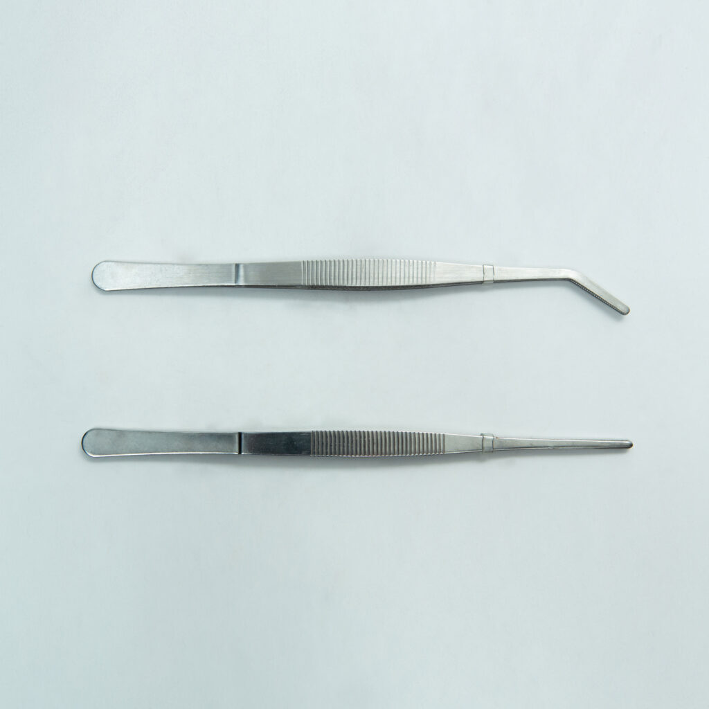 Two stainless steel Plant Tissue Culture Lab Forceps, one with a straight tip and one with a curved tip (15 cm each), are shown on a plain light background. These forceps are ideal for precise handling in various laboratory applications.