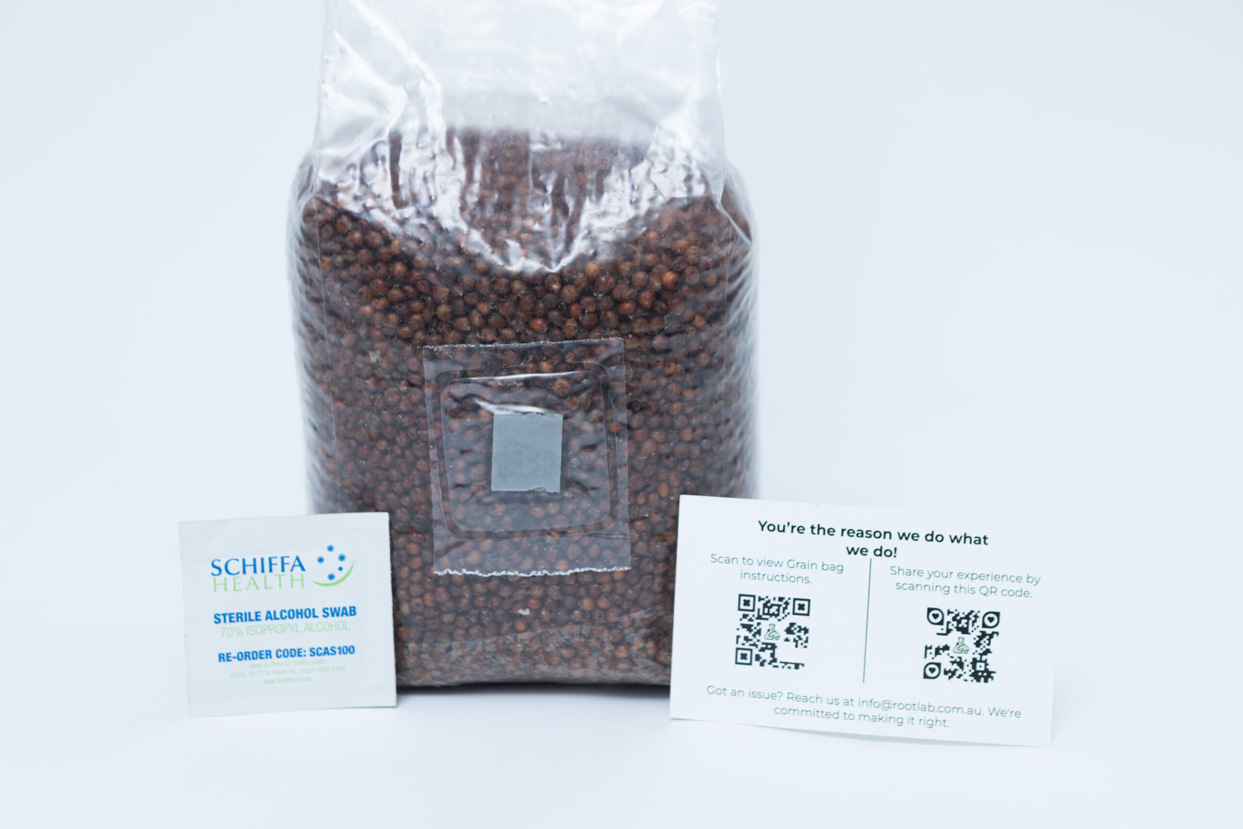 Sorghum(Milo) Pre sterilised for mushroom cultivation w/inj port and air-filter 1kg 3 A sealed bag of brown seeds with an alcohol swab sachet and a customer feedback card on a white background.